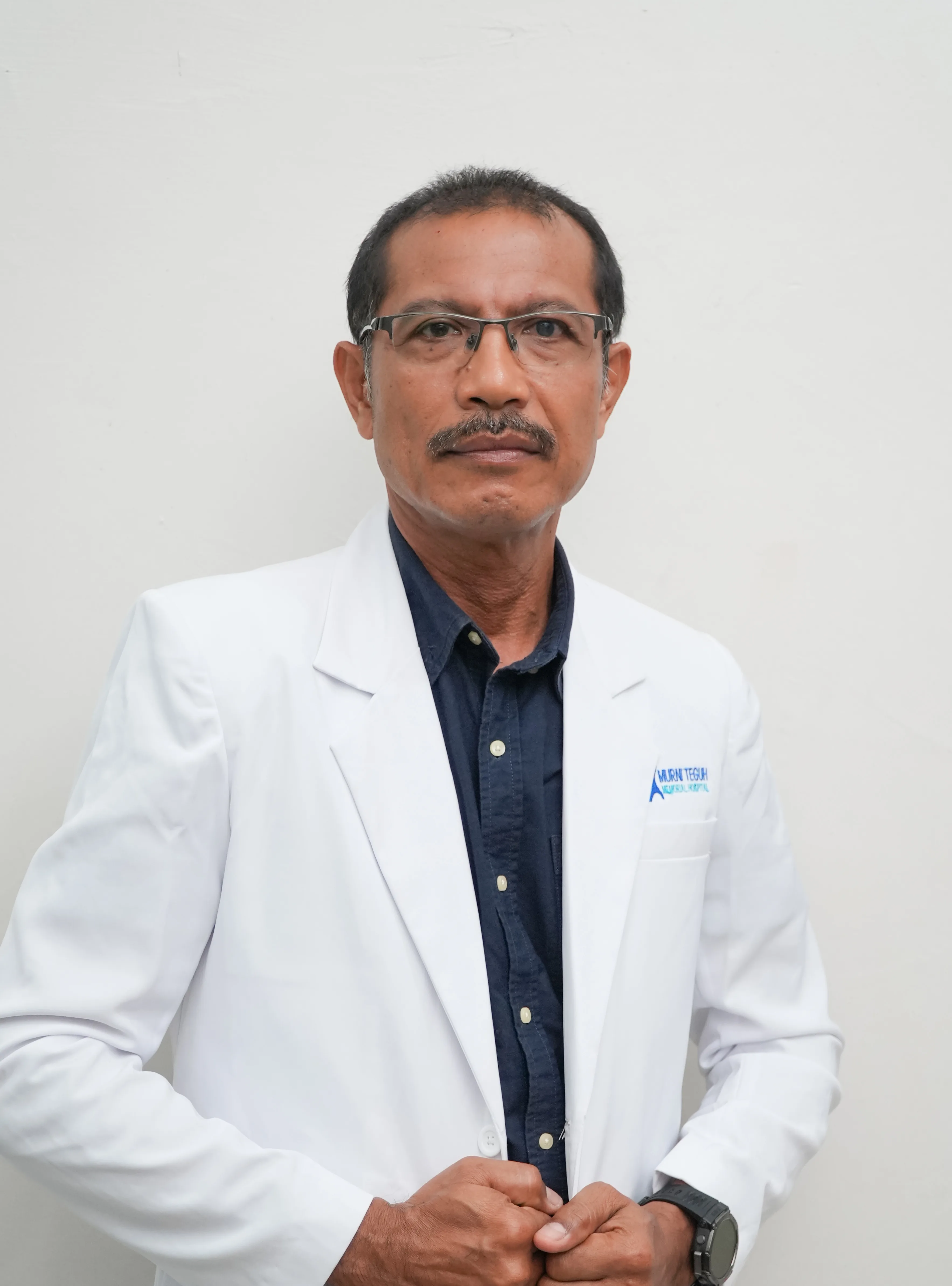 dr. Tuan Juniar Situmorang, M.Kes